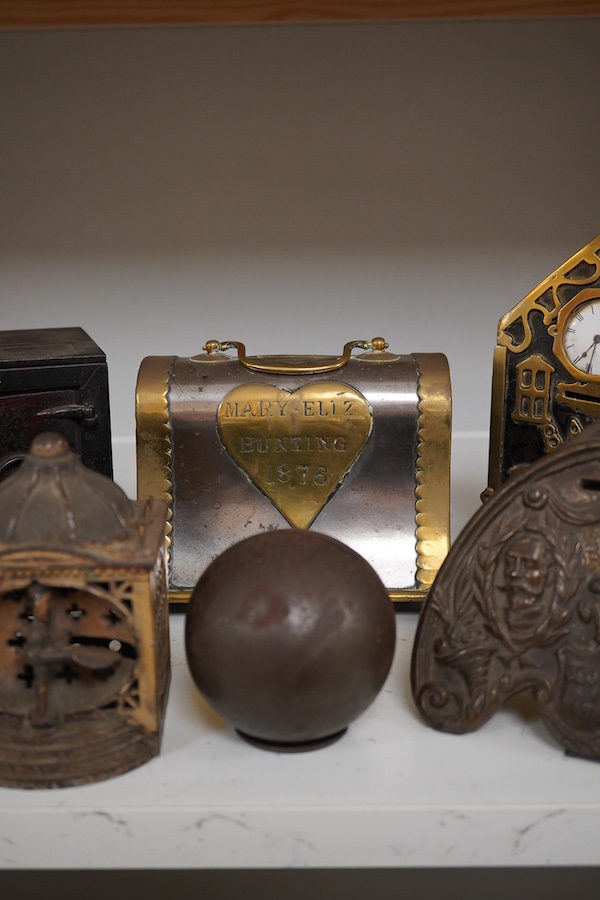 Six various metalware money boxes to include a ‘cannonball’ money box, a ‘safe’ money box, a George V ‘Royal Bank’ money box etc. 19th century and later. Condition - fair